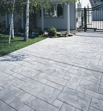 Gray stone shaped concrete patio.