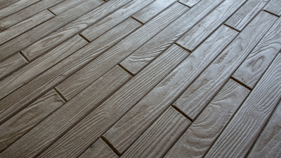 Wood plank stamped concrete floor.